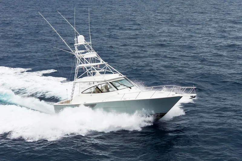 Slide: The Image of 2018 Viking 44 Express yacht cruising on open ocean waters. - 9