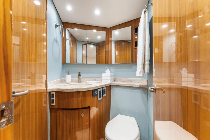 Slide: The Image of Luxurious bathroom interior of 2018 Viking 44 Express yacht with wood accents and modern fixtures. - 92