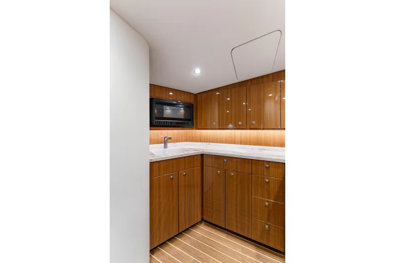 Slide: The Image of Luxurious wooden kitchen interior of 2018 Viking 44 Express yacht with modern amenities. - 96