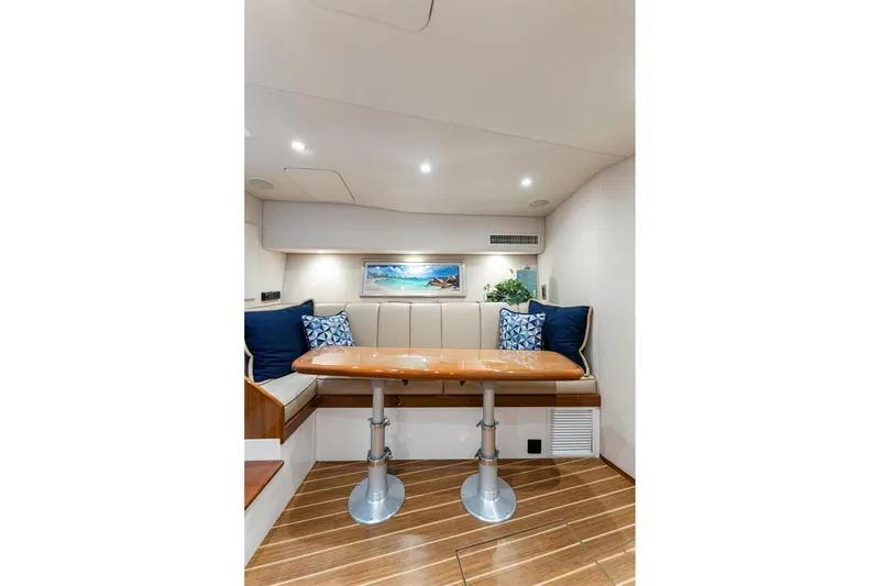 Slide: The Image of Luxurious interior of 2018 Viking 44 Express yacht with elegant seating and wooden table. - 97