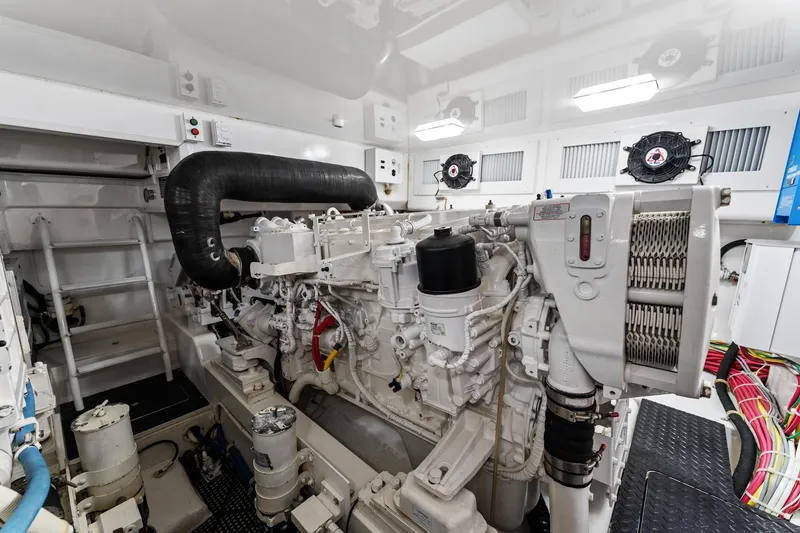 Slide: The Image of Engine room of 2018 Viking 44 Open yacht, showcasing detailed machinery and components. - 100