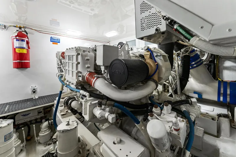 Slide: The Image of Engine room of 2018 Viking 44 Open yacht with MAN engine and fire extinguisher. - 102
