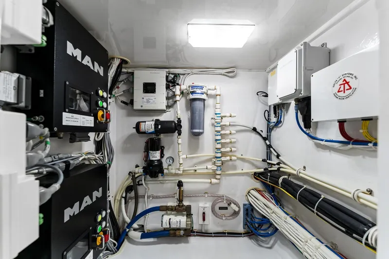 Slide: The Image of Engine room of 2018 Viking 44 Open yacht, featuring MAN systems and complex wiring. - 107
