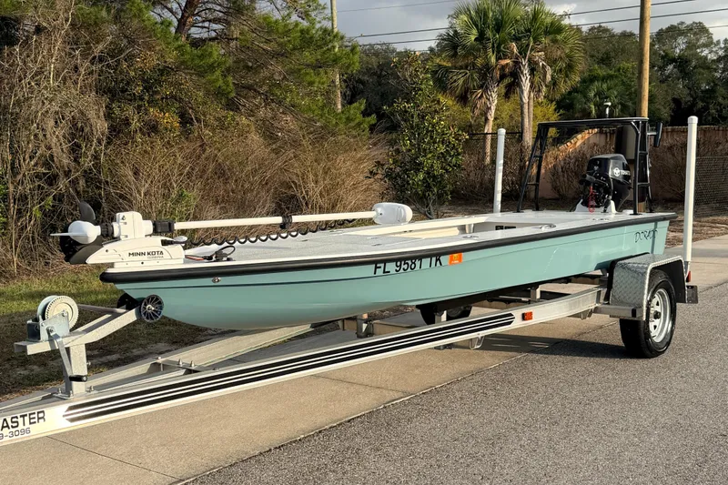 The Image of 2023 Dorado 16 Skiff boat on trailer, equipped with Minn Kota motor. - 1