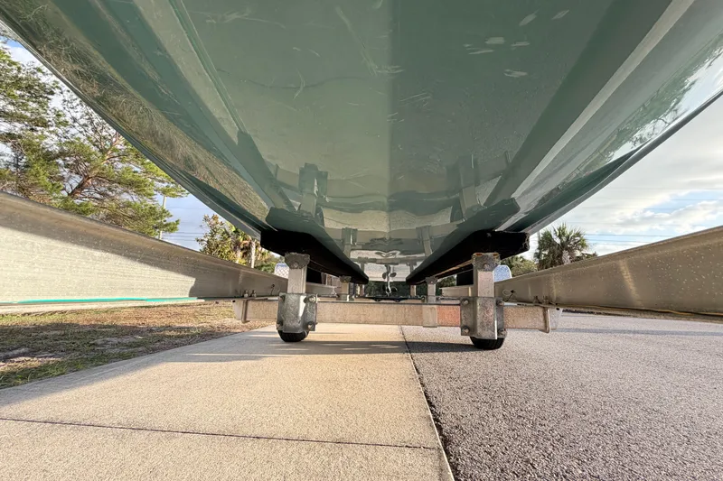 Slide: The Image of Underside view of 2023 Dorado 16 Skiff on a trailer, showcasing hull design. - 11