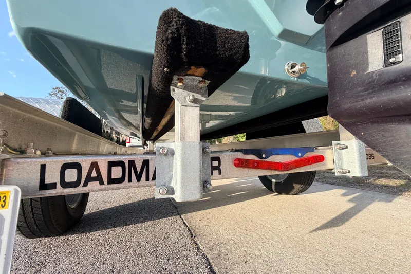Slide: The Image of Trailer supporting a 2023 Dorado 16 Skiff boat, showcasing Loadmaster branding. - 15