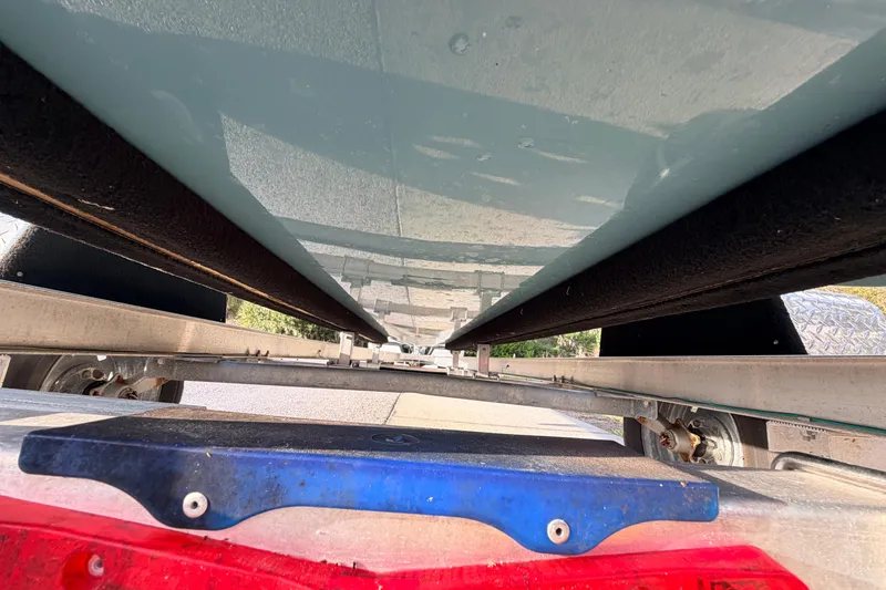 Slide: The Image of Underside view of 2023 Dorado 16 Skiff on a trailer. - 17