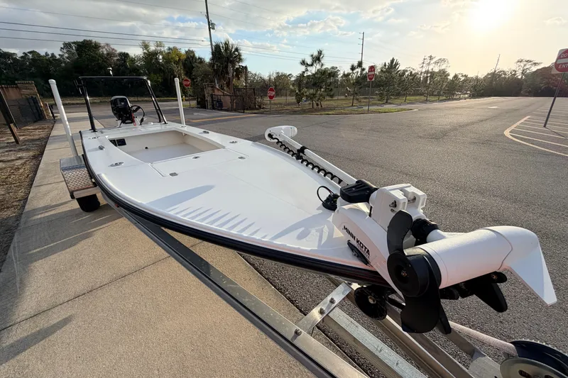 Slide: The Image of 2023 Dorado 16 Skiff boat on trailer, featuring Minn Kota trolling motor. - 24