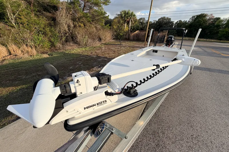 Slide: The Image of 2023 Dorado 16 Skiff boat with Minn Kota trolling motor on trailer. - 25