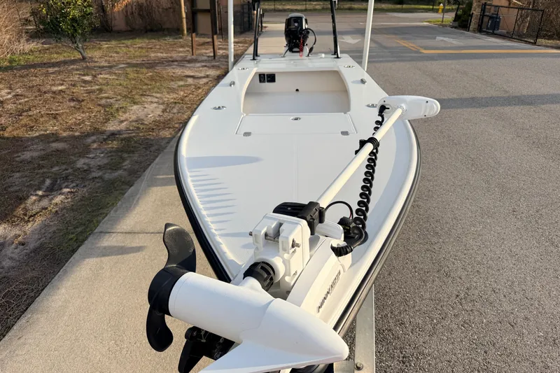 Slide: The Image of 2023 Dorado 16 Skiff boat with trolling motor on a paved surface. - 26