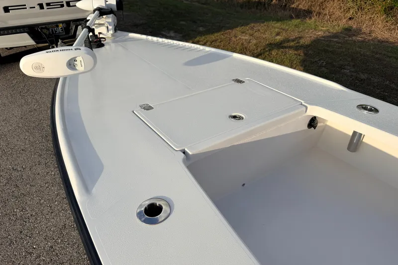 Slide: The Image of 2023 Dorado 16 Skiff boat deck with storage compartment and trolling motor. - 27