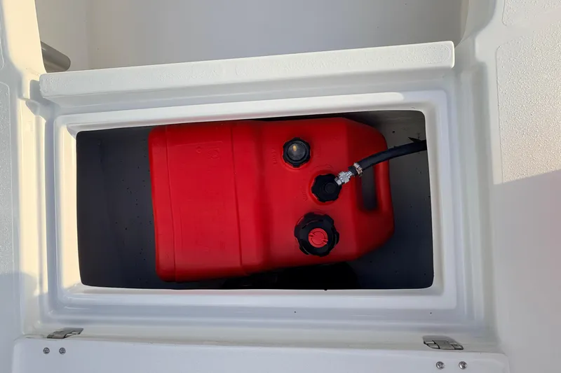 Slide: The Image of Red fuel tank in storage compartment of 2023 Dorado 16 Skiff boat. - 30