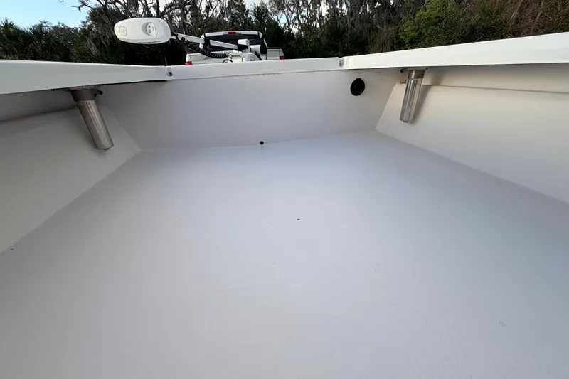 Slide: The Image of 2023 Dorado 16 Skiff interior view with rod holders and clean deck. - 35