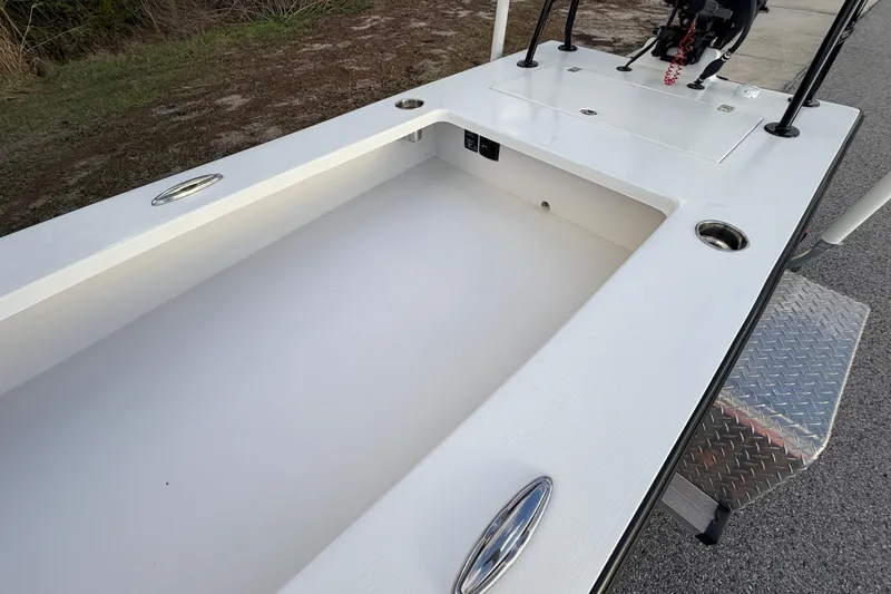 Slide: The Image of 2023 Dorado 16 Skiff boat interior with clean white deck and storage compartments. - 36