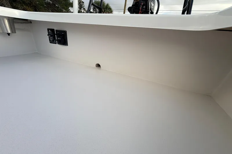 Slide: The Image of 2023 Dorado 16 Skiff interior detail showcasing clean, minimalist design and control panel. - 38