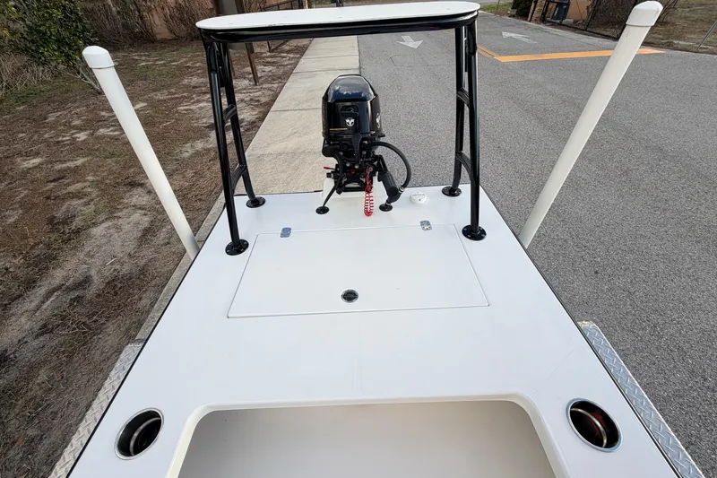 Slide: The Image of 2023 Dorado 16 Skiff boat with motor, parked on a paved road. - 39