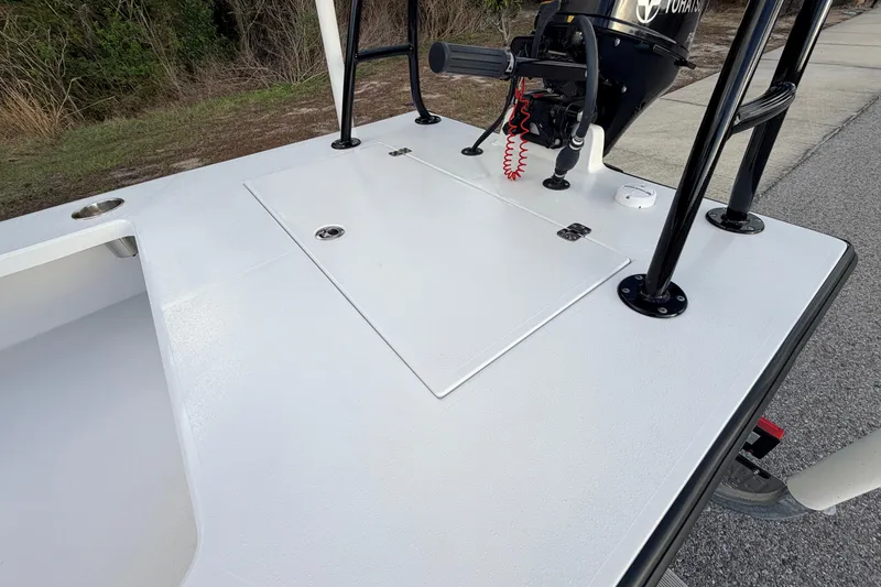 Slide: The Image of 2023 Dorado 16 Skiff boat deck with motor and storage hatch. - 40