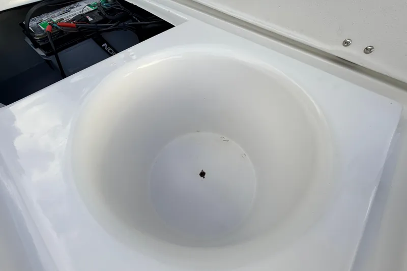 Slide: The Image of 2023 Dorado 16 Skiff boat compartment with battery and circular storage area. - 42