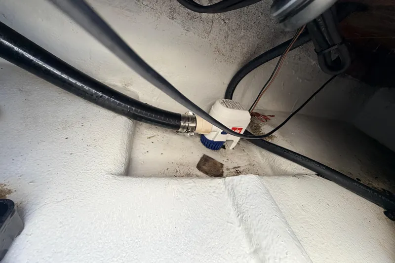 Slide: The Image of Bilge area of 2023 Dorado 16 Skiff with pump and hoses visible. - 45