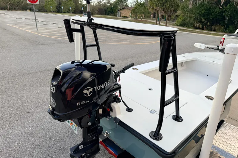 Slide: The Image of 2023 Dorado 16 Skiff with Tohatsu outboard motor in a parking lot. - 47