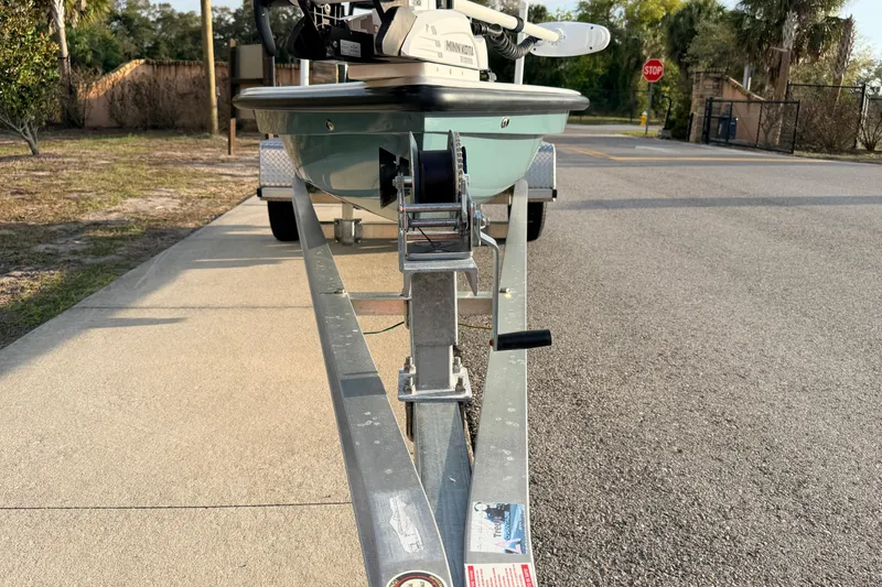 Slide: The Image of 2023 Dorado 16 Skiff on trailer, parked on a sunny street. - 7