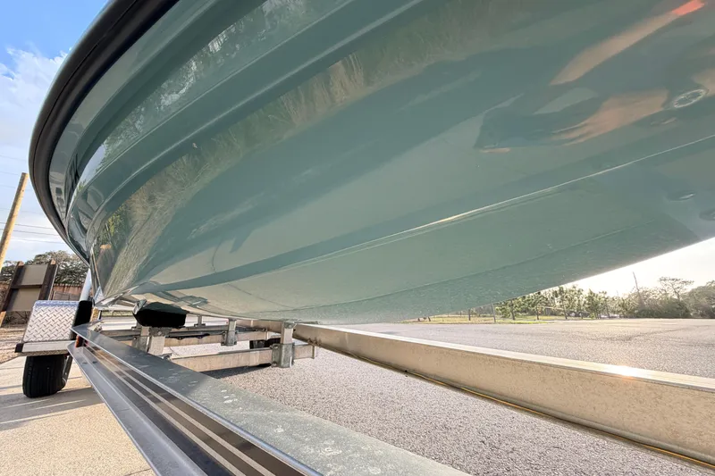 Slide: The Image of 2023 Dorado 16 Skiff boat on trailer, showcasing sleek hull design. - 9