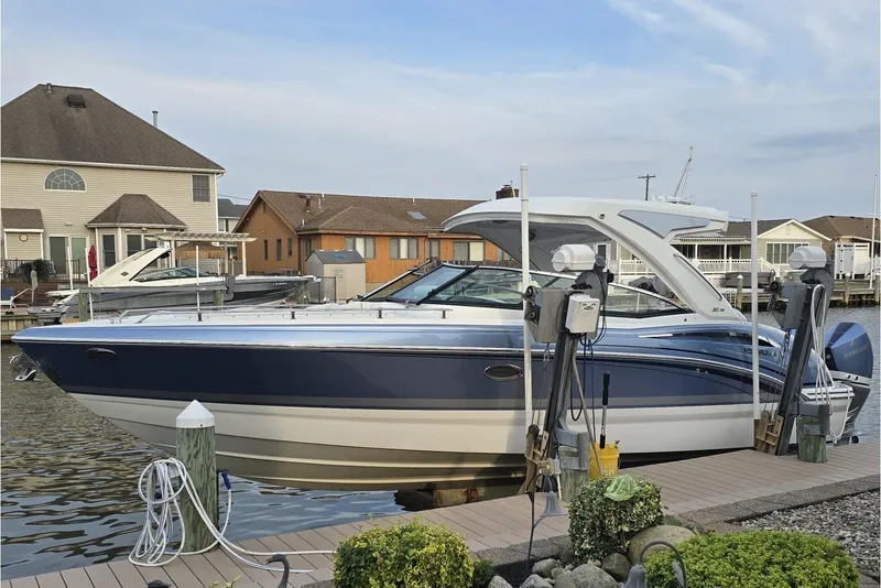 The Image of 2020 Formula 310 Bowrider OB docked at a waterfront residential area. - 0