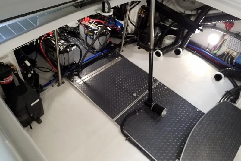 Slide: The Image of 2020 Formula 310 Bowrider OB engine compartment with batteries and wiring. - 11