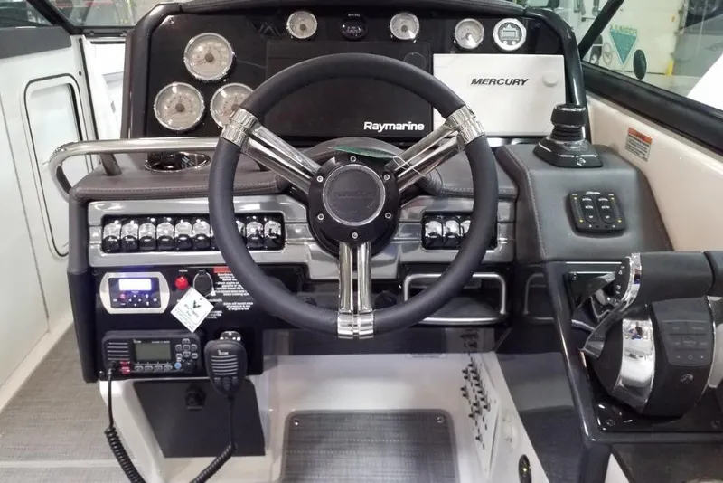 Slide: The Image of 2020 Formula 310 Bowrider OB dashboard with steering wheel and control panel. - 12