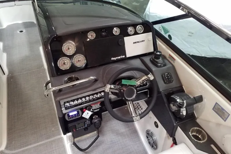 Slide: The Image of 2020 Formula 310 Bowrider OB dashboard with steering wheel and control panel. - 13