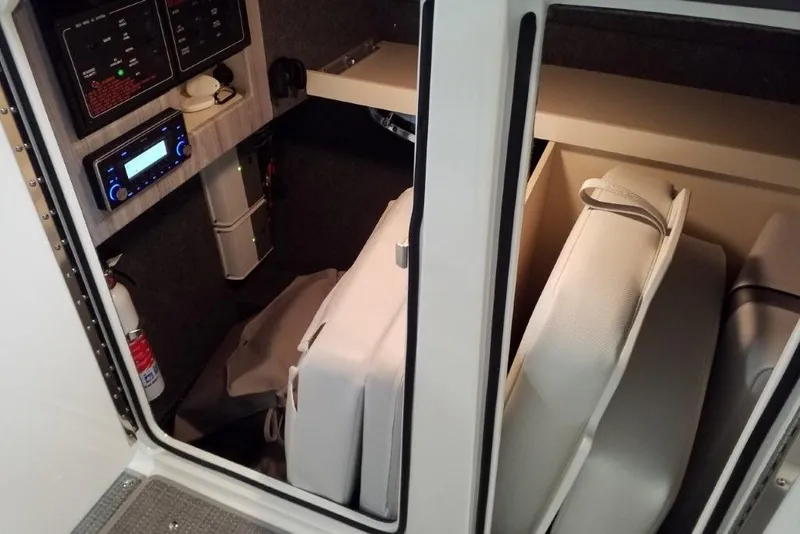 Slide: The Image of Interior cabin of 2020 Formula 310 Bowrider OB with storage and control panels. - 15