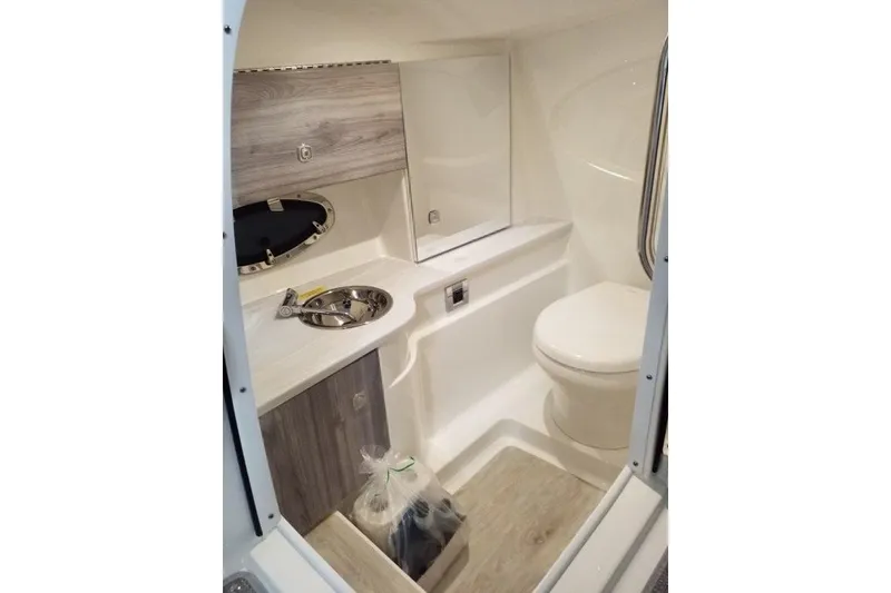 Slide: The Image of 2020 Formula 310 Bowrider OB boat bathroom with sink and toilet. - 16