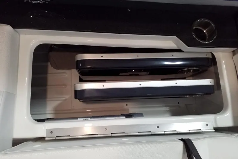 Slide: The Image of Storage compartment in a 2020 Formula 310 Bowrider OB boat, featuring organized interior space. - 9