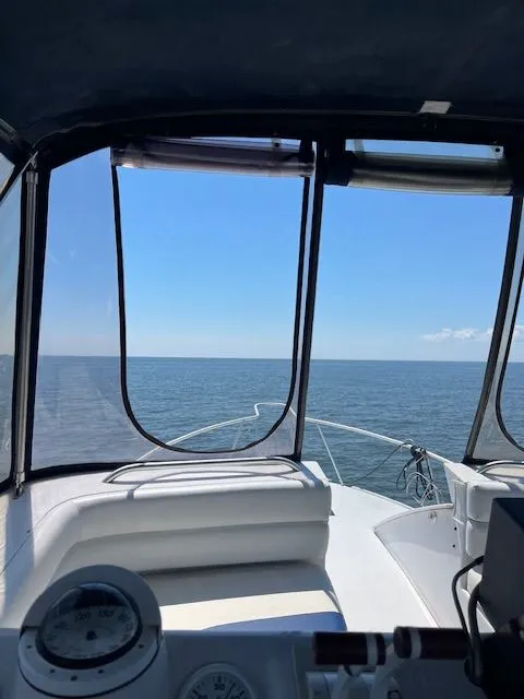 Slide: The Image of View from 1998 Mainship Sedan Bridge overlooking open sea. - 7