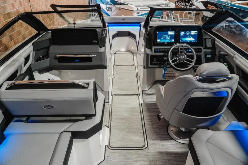 Slide: The Image of Interior of 2026 Cobalt R4 boat with modern dashboard and seating. - 11