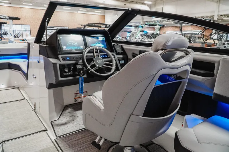 Slide: The Image of Interior of 2026 Cobalt R4 boat with modern dashboard and steering wheel. - 12
