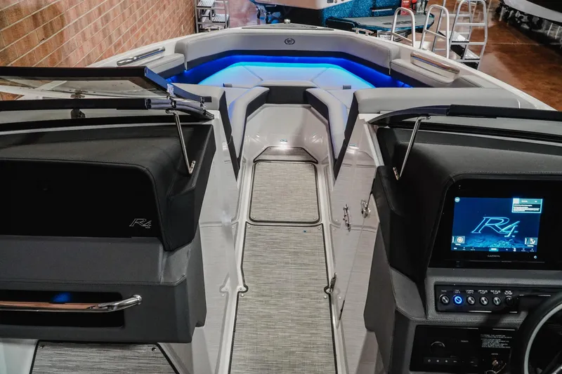 Slide: The Image of 2026 Cobalt R4 boat interior with modern dashboard and ambient blue lighting. - 15