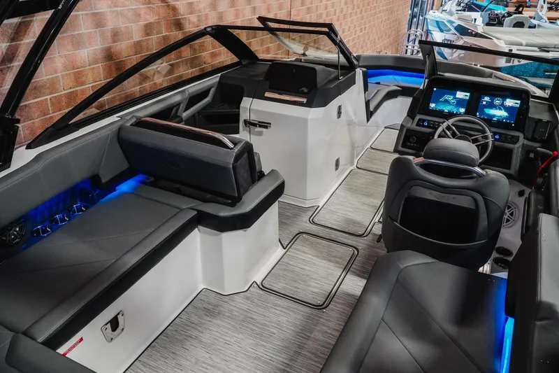 Slide: The Image of 2026 Cobalt R6 boat interior with modern seating, digital dashboard, and ambient lighting. - 11