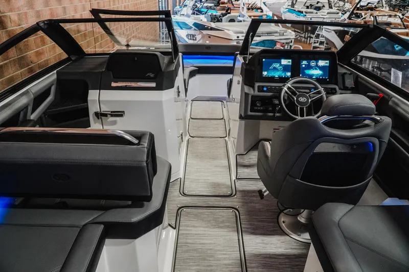 Slide: The Image of 2026 Cobalt R6 boat interior with modern dashboard and seating. - 12