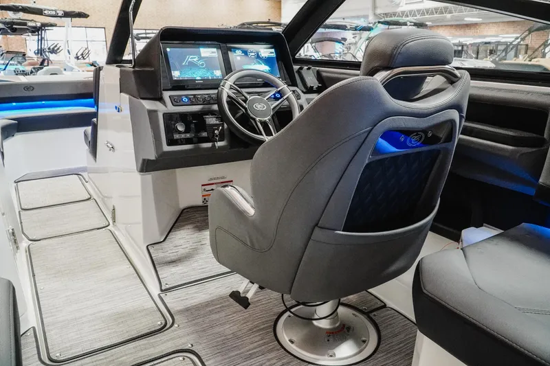 Slide: The Image of Interior of 2026 Cobalt R6 boat with modern dashboard and captain's chair. - 13