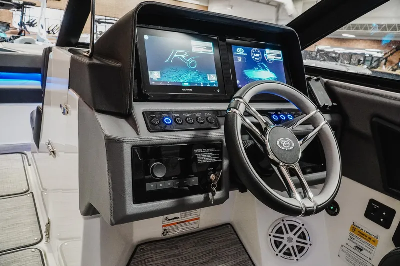 Slide: The Image of Dashboard of a 2026 Cobalt R6 boat featuring advanced navigation displays and controls. - 16
