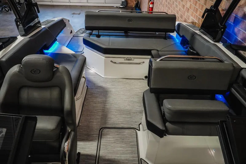 Slide: The Image of 2026 Cobalt R6 boat interior with gray seating and blue ambient lighting. - 20