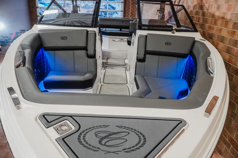 Slide: The Image of 2026 Cobalt R6 boat interior with gray seating and blue LED lighting. - 4