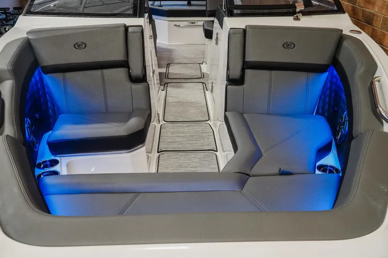 Slide: The Image of Luxurious interior of 2026 Cobalt R6 boat with blue LED lighting and gray seating. - 5