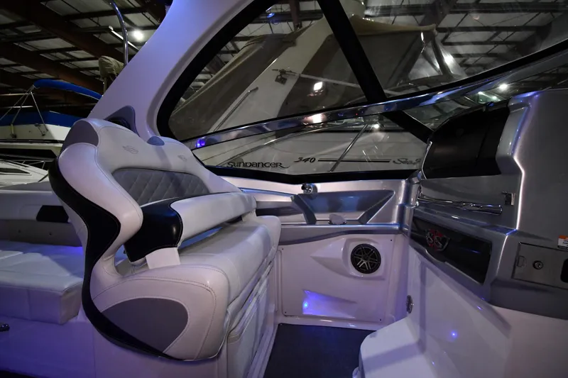 Slide: The Image of Interior of a 2014 Chaparral 327 SSX boat with luxurious seating and modern dashboard. - 10