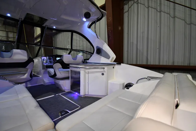 Slide: The Image of Interior of 2014 Chaparral 327 SSX boat with luxurious seating and modern amenities. - 11