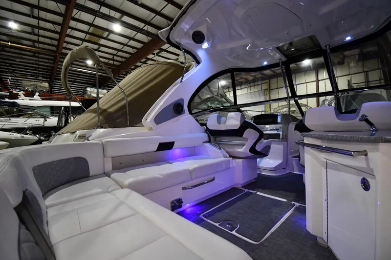 Slide: The Image of Luxurious interior of 2014 Chaparral 327 SSX boat with modern seating and ambient lighting. - 12