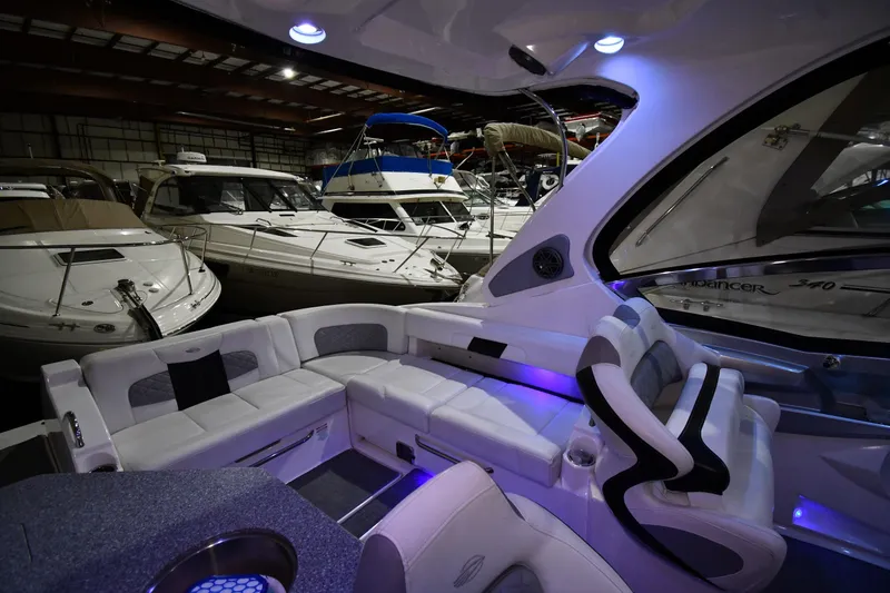 Slide: The Image of Luxurious interior of a 2014 Chaparral 327 SSX boat in a marina setting. - 13