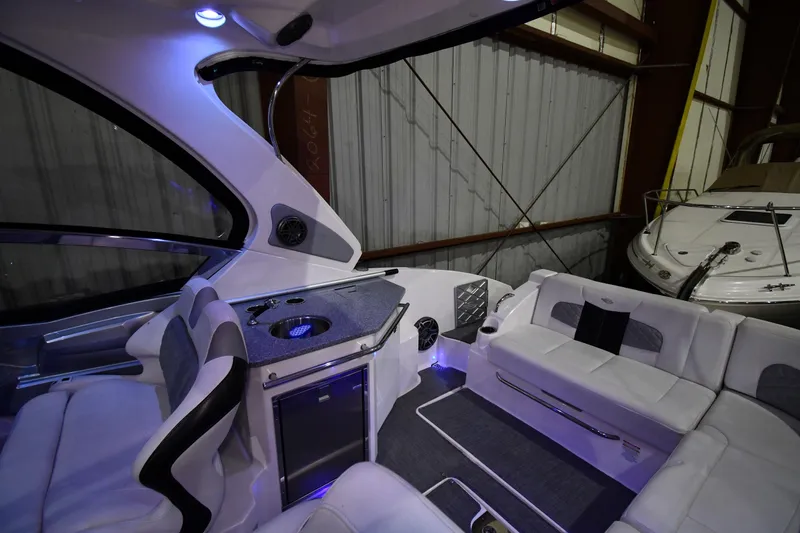 Slide: The Image of Interior of 2014 Chaparral 327 SSX boat with luxurious seating and modern amenities. - 14