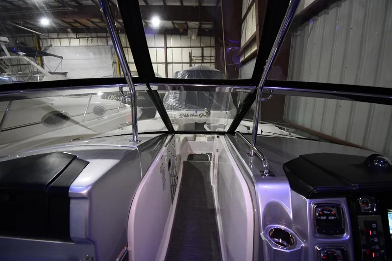 Slide: The Image of 2014 Chaparral 327 SSX boat interior in a storage facility. - 17